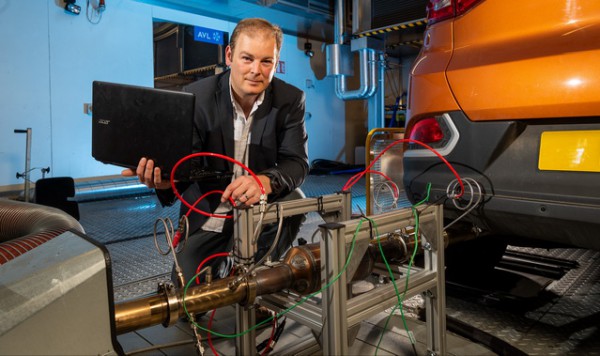 29738 Chris Bannister and Chassis Dyno 22 Oct 2018. Bath and SAIC Motor team up to investigate gasoline particulate filter performance. Chris is pictured with the GPF on the rig.  Client:  Rob Breckon - Corp Comms