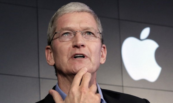 FILE - In this April 30, 2015 file photo, Apple CEO Tim Cook responds to a question during a news conference at IBM Watson headquarters, in New York. Cook avoided commenting on reports that Apple may be building its own car, according to a video recording of his remarks Monday, Oct. 19, 2015, at a technology conference sponsored by the Wall Street Journal. (AP Photo/Richard Drew, File)